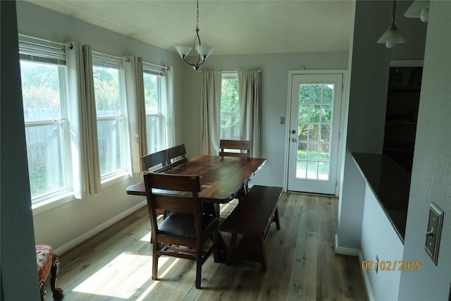 305 Duprie Dr, Brenham, TX 77833 - dining room with wood finished floors and a chandelier