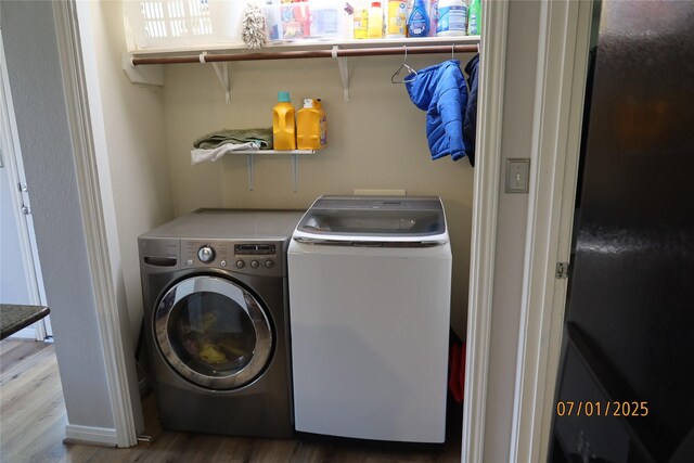 305 Duprie Dr, Brenham, TX 77833 - laundry room featuring washing machine and dryer and wood finished floors