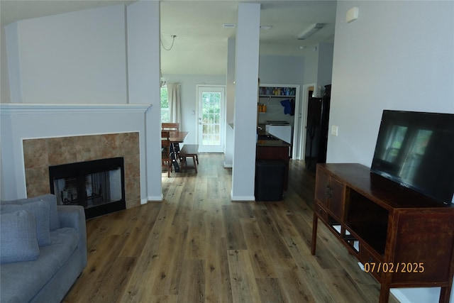 305 Duprie Dr, Brenham, TX 77833 - living room with wood finished floors and a tiled fireplace