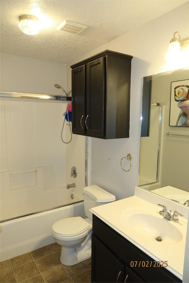 305 Duprie Dr, Brenham, TX 77833 - bathroom with a textured ceiling, vanity, shower / washtub combination, and tile patterned flooring
