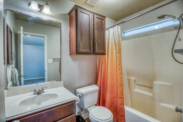 305 Duprie Dr, Brenham, TX 77833 - bathroom with vanity, shower / bath combination with curtain, a textured ceiling, and a textured wall