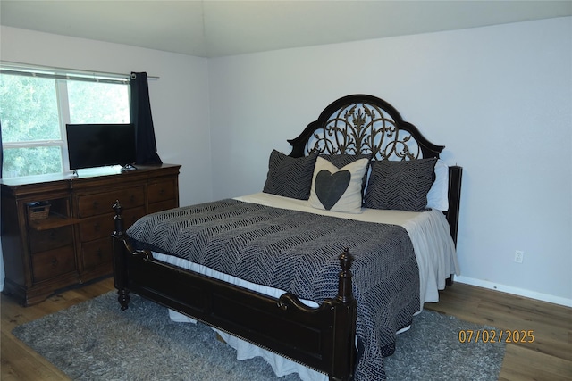 305 Duprie Dr, Brenham, TX 77833 - bedroom featuring wood finished floors and baseboards