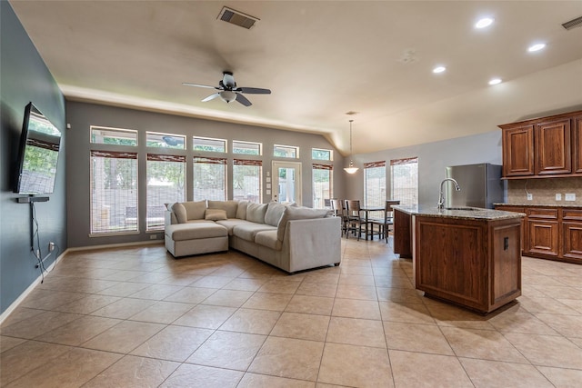 3211 Rock Brook Falls Ln, League City, TX 77573 - living room featuring ceiling fan, light tile patterned flooring, and recessed lighting