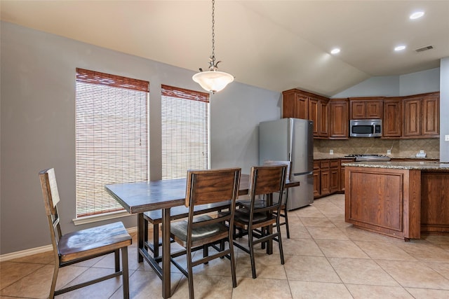 3211 Rock Brook Falls Ln, League City, TX 77573 - dining space featuring light tile patterned floors, lofted ceiling, and recessed lighting