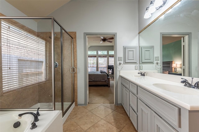3211 Rock Brook Falls Ln, League City, TX 77573 - ensuite bathroom with a ceiling fan, double vanity, a shower stall, and tile patterned flooring