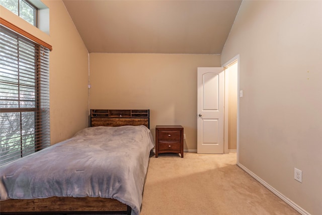 3211 Rock Brook Falls Ln, League City, TX 77573 - bedroom with lofted ceiling and light carpet
