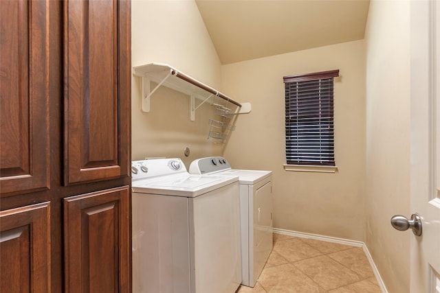 3211 Rock Brook Falls Ln, League City, TX 77573 - laundry area with washing machine and clothes dryer and light tile patterned floors