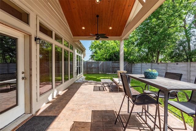 3211 Rock Brook Falls Ln, League City, TX 77573 - fenced backyard with outdoor dining area, a patio area, and ceiling fan