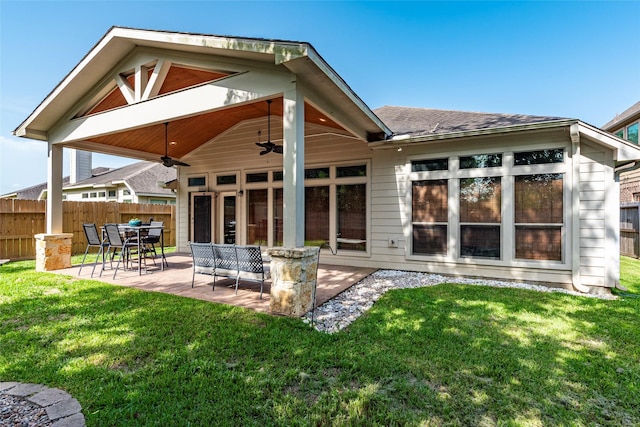 3211 Rock Brook Falls Ln, League City, TX 77573 - rear view of house with a ceiling fan, a patio area, and a shingled roof