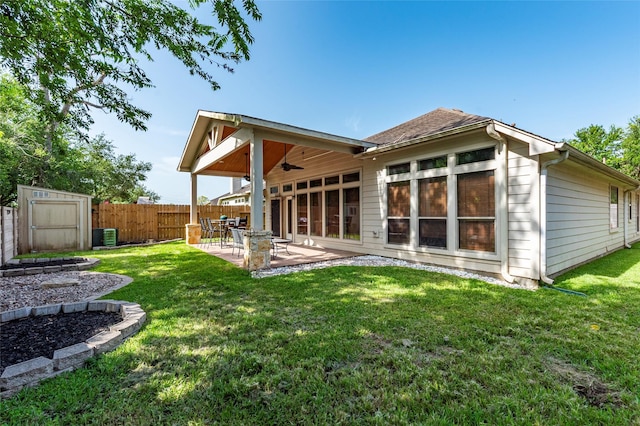 3211 Rock Brook Falls Ln, League City, TX 77573 - rear view of property featuring a ceiling fan, a patio area, a storage shed, and roof with shingles