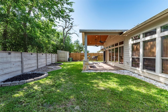 3211 Rock Brook Falls Ln, League City, TX 77573 - fenced backyard with a ceiling fan, a shed, and a patio