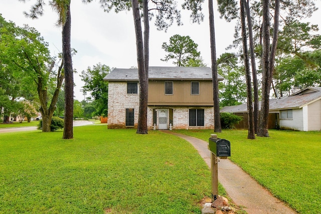 17010 Kings Walk Ln, Houston, TX 77070 - view of front of house featuring a front lawn and brick siding