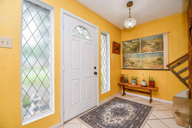 17010 Kings Walk Ln, Houston, TX 77070 - entrance foyer featuring light tile patterned floors and a textured ceiling