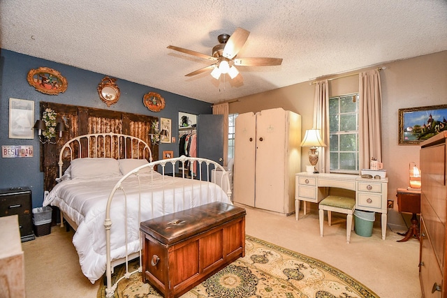 17010 Kings Walk Ln, Houston, TX 77070 - bedroom with carpet floors, a textured ceiling, freestanding refrigerator, and a ceiling fan