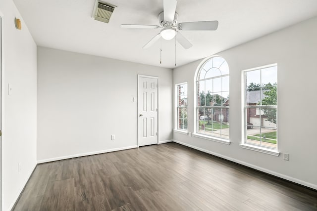 20907 Divellec Ln, Spring, TX 77388 - empty room with dark wood-style flooring, a ceiling fan, and a smoke detector