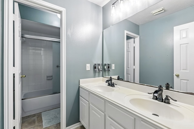 20907 Divellec Ln, Spring, TX 77388 - bathroom featuring double vanity and bathing tub / shower combination