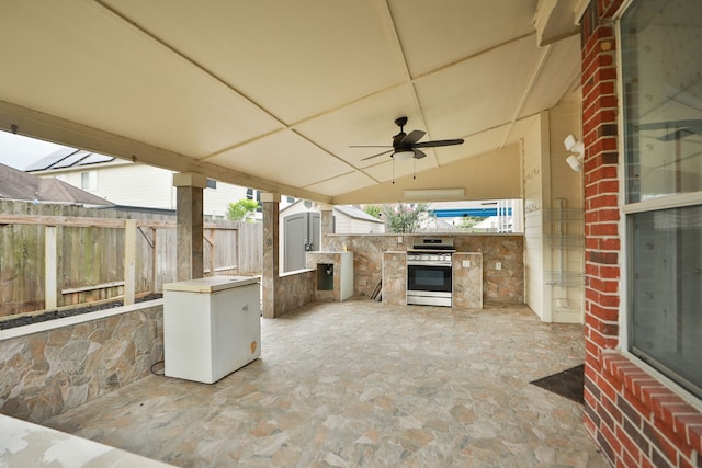 20907 Divellec Ln, Spring, TX 77388 - fenced backyard featuring a shed, exterior kitchen, a ceiling fan, and a patio area