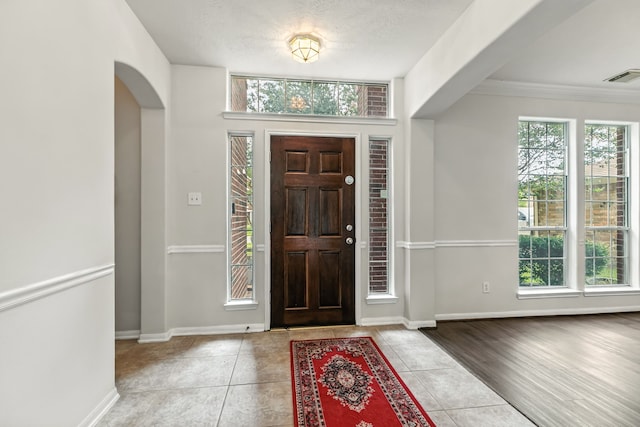 20907 Divellec Ln, Spring, TX 77388 - tiled foyer featuring arched walkways and ornamental molding