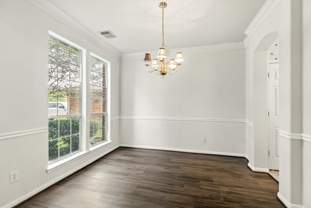 20907 Divellec Ln, Spring, TX 77388 - unfurnished dining area featuring a chandelier, ornamental molding, dark wood-style flooring, and arched walkways