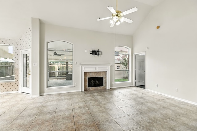 20907 Divellec Ln, Spring, TX 77388 - unfurnished living room with a ceiling fan, high vaulted ceiling, a tile fireplace, and tile patterned floors