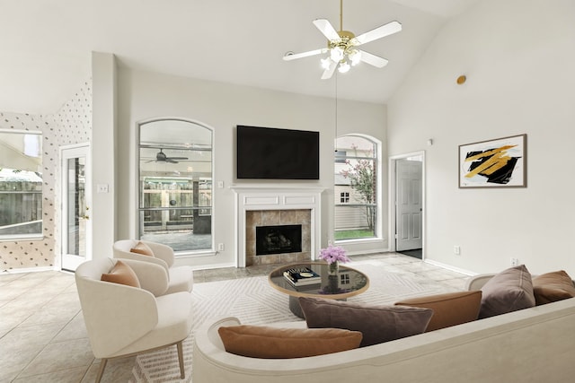 20907 Divellec Ln, Spring, TX 77388 - living room featuring ceiling fan, high vaulted ceiling, a fireplace, and light tile patterned floors