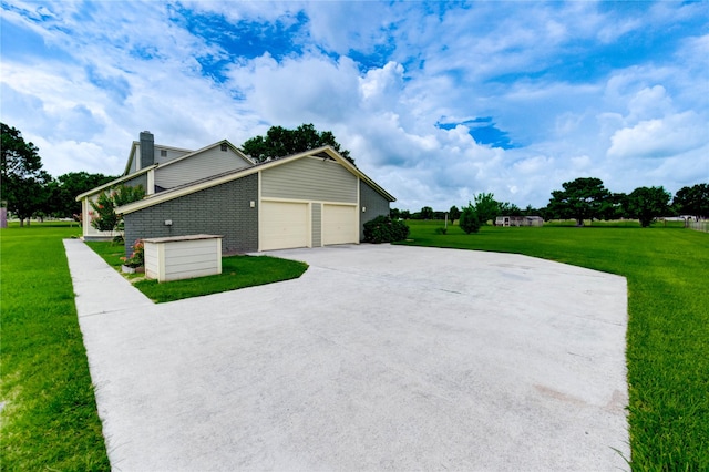 6606 Williams School Ct, Needville, TX 77461 - view of home's exterior with brick siding, a chimney, an attached garage, and a lawn