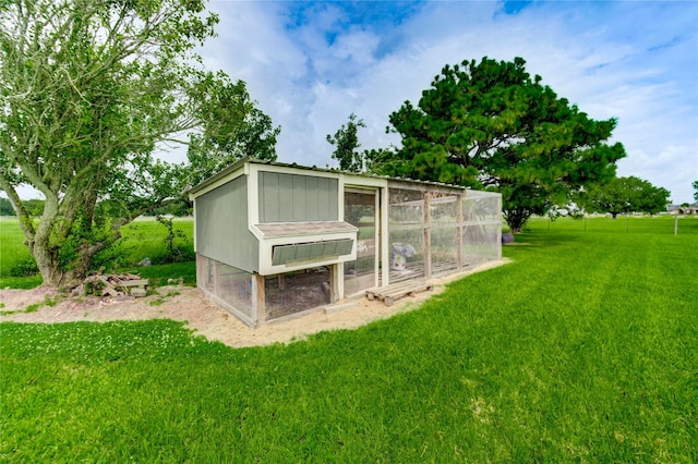 6606 Williams School Ct, Needville, TX 77461 - view of poultry coop with a lawn and a garage