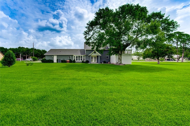 6606 Williams School Ct, Needville, TX 77461 - view of front of house with a front lawn and french doors