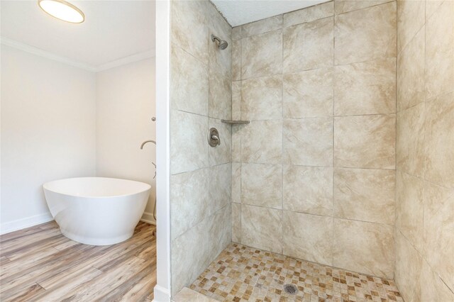 6606 Williams School Ct, Needville, TX 77461 - full bathroom with crown molding, wood finished floors, a tile shower, and a freestanding tub