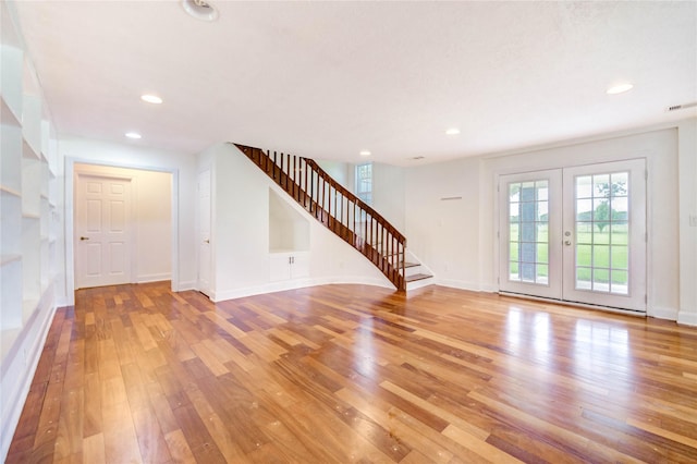 6606 Williams School Ct, Needville, TX 77461 - entrance foyer with stairway, light wood finished floors, recessed lighting, and french doors