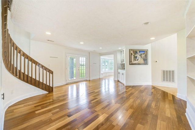 6606 Williams School Ct, Needville, TX 77461 - unfurnished living room with hardwood / wood-style flooring, stairway, and recessed lighting