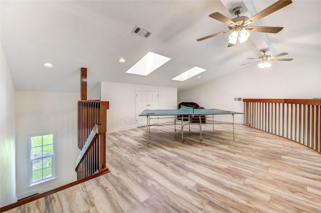 6606 Williams School Ct, Needville, TX 77461 - recreation room with vaulted ceiling, a skylight, light wood-style flooring, and recessed lighting