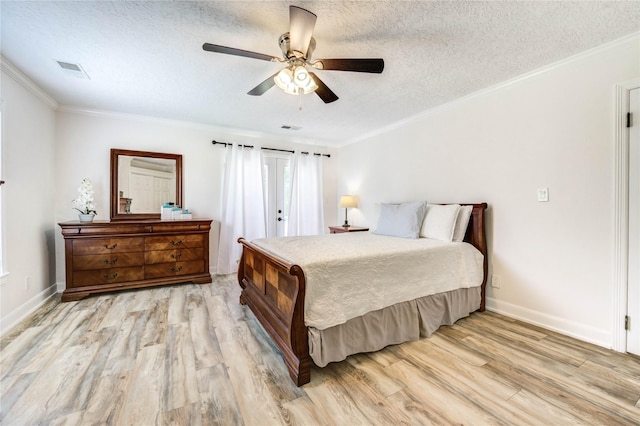 6606 Williams School Ct, Needville, TX 77461 - bedroom featuring light wood-style floors, crown molding, a textured ceiling, and ceiling fan