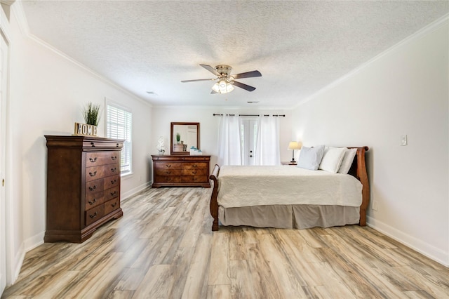 6606 Williams School Ct, Needville, TX 77461 - bedroom featuring light wood-type flooring, crown molding, a textured ceiling, and ceiling fan