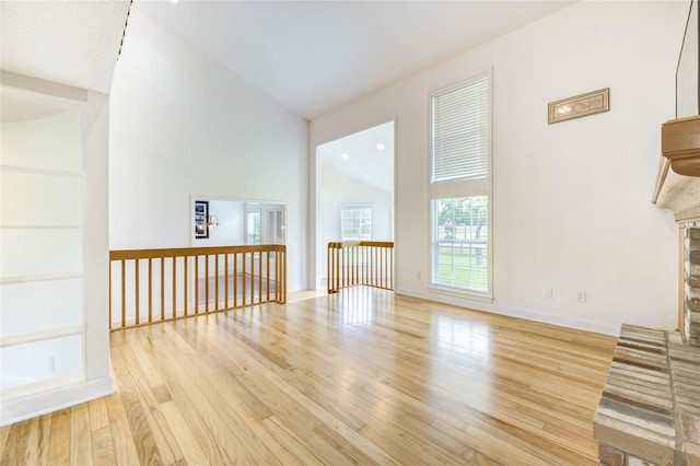 6606 Williams School Ct, Needville, TX 77461 - unfurnished living room featuring wood finished floors, lofted ceiling, and a fireplace