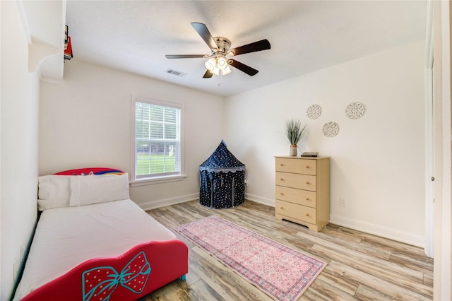 6606 Williams School Ct, Needville, TX 77461 - bedroom with wood finished floors and a ceiling fan
