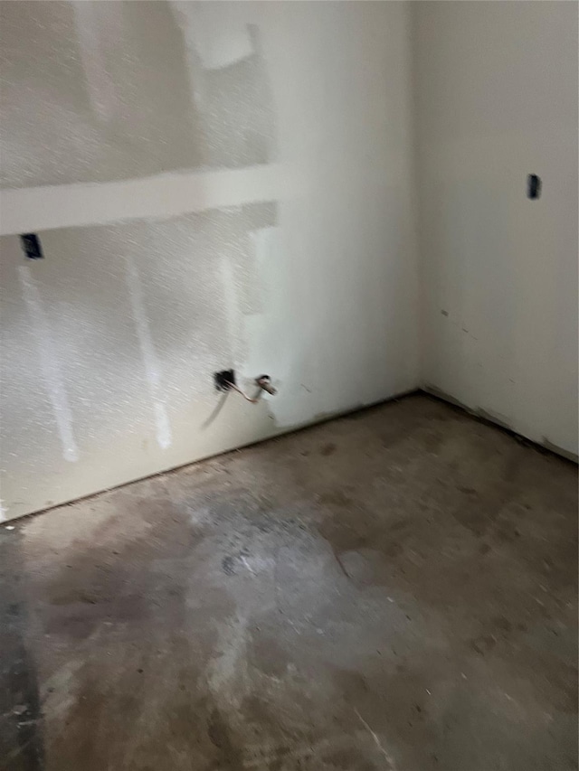 9407 Sandra St, Houston, TX 77016 - empty room with unfinished concrete flooring