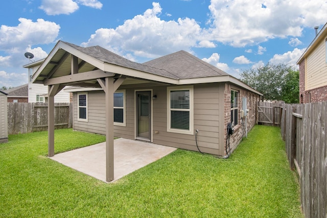 14039 Embry Stone Ln, Houston, TX 77047 - rear view of house with a patio area, a fenced backyard, and a shingled roof