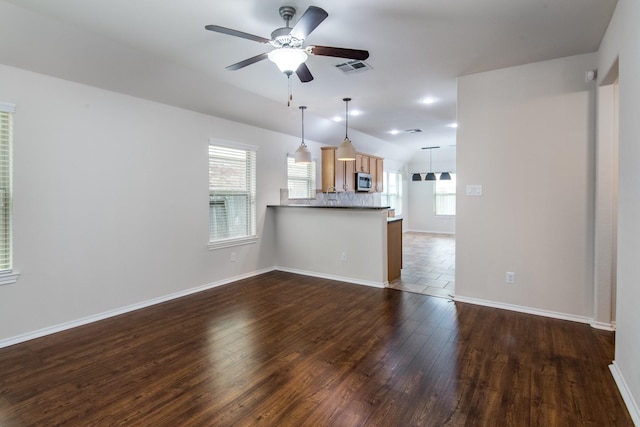 14039 Embry Stone Ln, Houston, TX 77047 - unfurnished living room with dark wood-style floors, a ceiling fan, and lofted ceiling