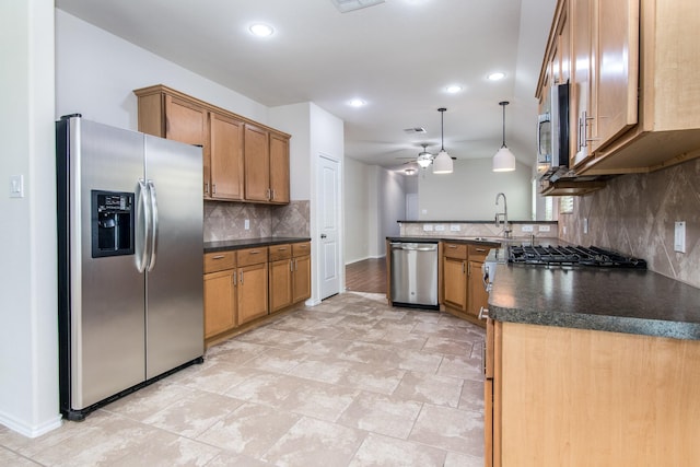 14039 Embry Stone Ln, Houston, TX 77047 - kitchen with stainless steel appliances, dark countertops, a peninsula, ceiling fan, and decorative backsplash