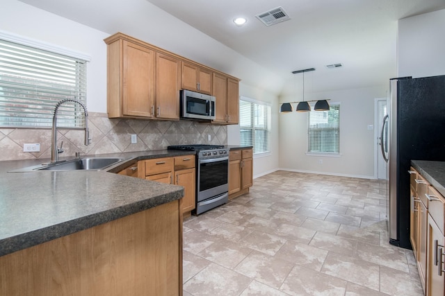 14039 Embry Stone Ln, Houston, TX 77047 - kitchen with stainless steel appliances, dark countertops, decorative backsplash, hanging light fixtures, and recessed lighting