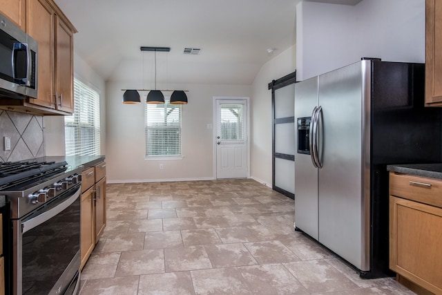 14039 Embry Stone Ln, Houston, TX 77047 - kitchen featuring stainless steel appliances, vaulted ceiling, tasteful backsplash, dark countertops, and a barn door