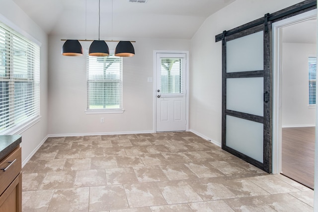 14039 Embry Stone Ln, Houston, TX 77047 - unfurnished dining area featuring a barn door and vaulted ceiling
