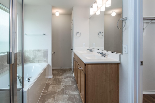 14039 Embry Stone Ln, Houston, TX 77047 - bathroom with double vanity, a bath, and stone finish flooring