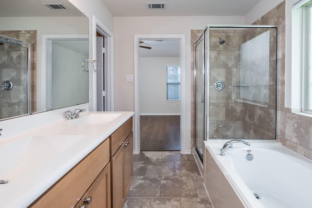 14039 Embry Stone Ln, Houston, TX 77047 - bathroom featuring healthy amount of natural light, a stall shower, a bath, and double vanity