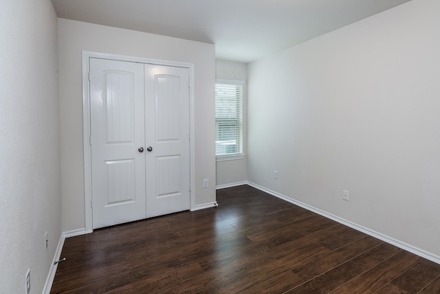14039 Embry Stone Ln, Houston, TX 77047 - unfurnished bedroom with dark wood-style flooring and a closet