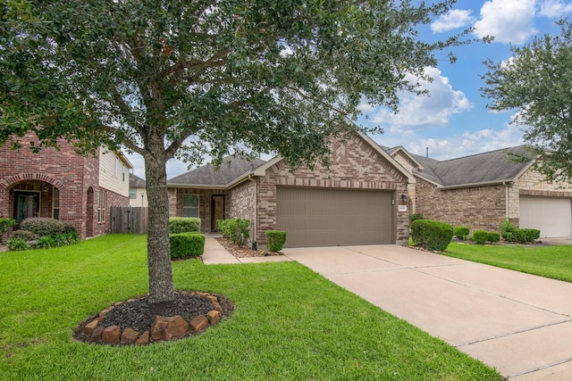 14039 Embry Stone Ln, Houston, TX 77047 - view of front facade featuring brick siding, an attached garage, concrete driveway, and roof with shingles
