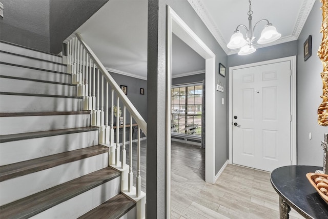 14018 Duncannon Dr, Houston, TX 77015 - entrance foyer with ornamental molding, a chandelier, light wood-type flooring, and stairs