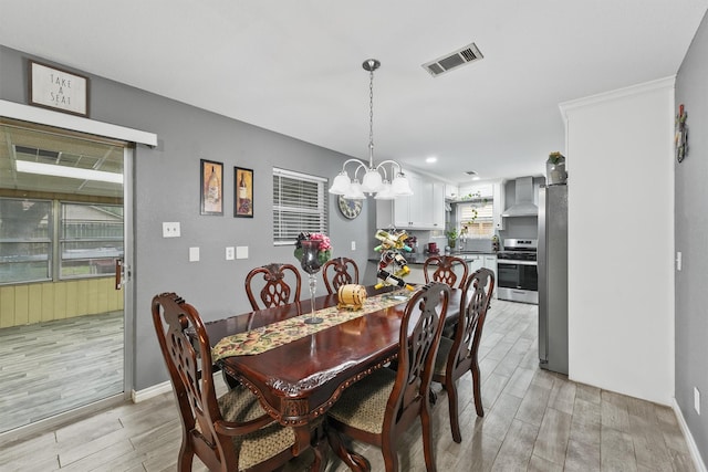 14018 Duncannon Dr, Houston, TX 77015 - dining room with light wood-type flooring and a chandelier