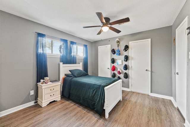 14018 Duncannon Dr, Houston, TX 77015 - bedroom with light wood finished floors and ceiling fan